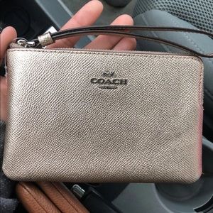 Metallic coach wristlet